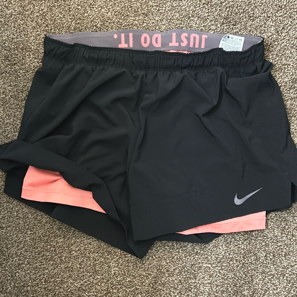 Black and light pink Nike shorts